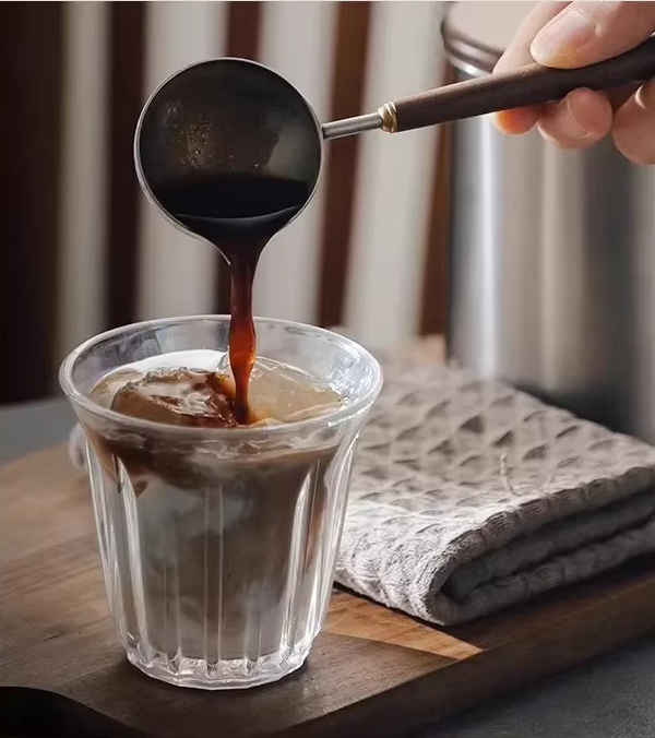 Barista Making Specialty Coffee Drinks Using Luxury Style Coffee Scoop For Measuring And Pouring
