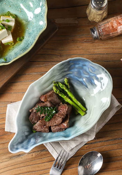 Steak And Asparagus In Oyster Dish Seashore Ceramic Serveware In Beach House Decor Style